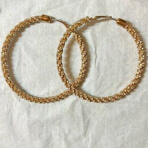 Large fashion sparkly hoop earrings.